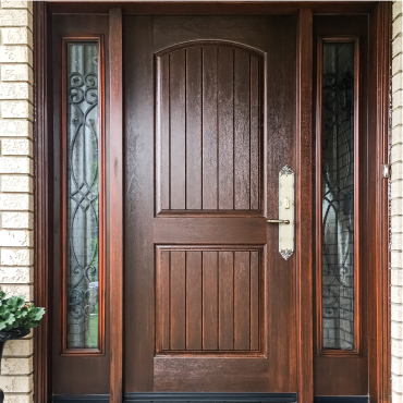 Fiberglass rustic style door with wrought iron panel sidelites and multi-lock system.